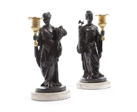 A PAIR OF REGENCY EBONISED PLASTER FIGURAL CANDLESTICKS IN THE MANNER OF HUMPHREY HOPPER, EARLY 19TH CENTURY modelled as clas