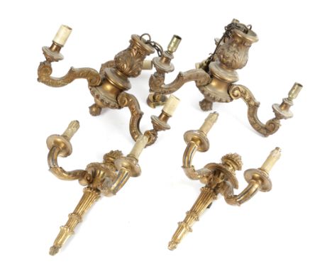 A PAIR OF ITALIAN GILTWOOD WALL LIGHTS EARLY 20TH CENTURY the backplate in the form of a flaming torch with twin-leaf scroll 