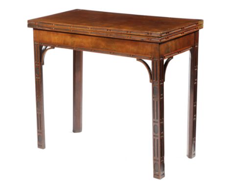 A GEORGE III MAHOGANY CARD TABLE IN CHINESE CHIPPENDALE STYLE, C.1770 with blind fret carved decoration, the fold-over top wi