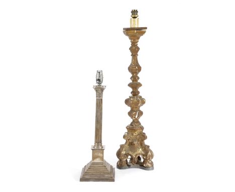 AN ITALIAN GILTWOOD ALTAR CANDLESTICK IN BAROQUE STYLE 18TH CENTURY later mounted on a lead base, together with a silver Cori