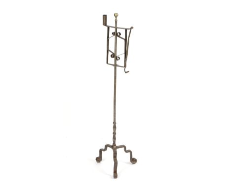 A GEORGE III STEEL FLOOR STANDING ADJUSTABLE CANDLEHOLDER 18TH CENTURY with a brass ball finial, with a cylindrical nozzle an