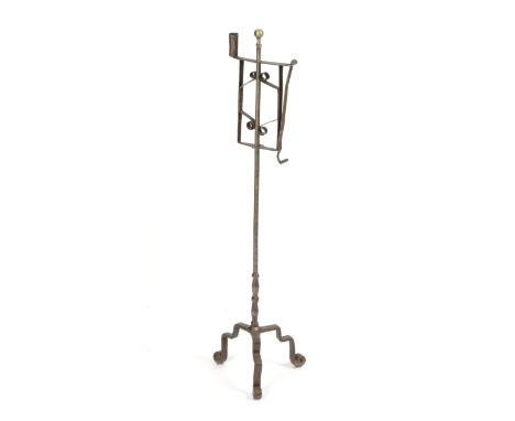 A GEORGE III STEEL FLOOR STANDING ADJUSTABLE CANDLEHOLDER 18TH CENTURY with a brass ball finial, with a cylindrical nozzle an