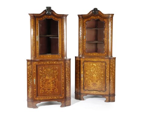 TWO SIMILAR DUTCH  WALNUT AND FLORAL MARQUETRY CORNER DISPLAY CABINETS 19TH CENTURY inlaid with urns of flowers, birds, cheru