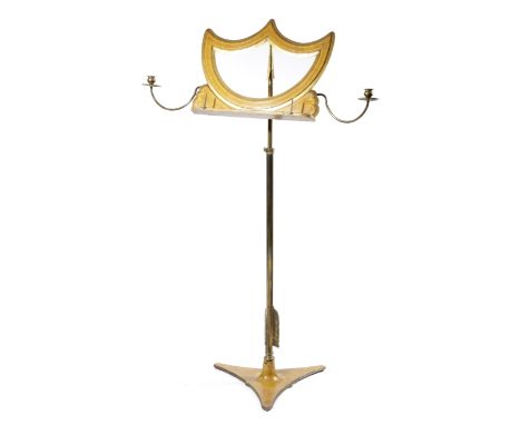 A LATE REGENCY BIRD'S EYE MAPLE AND GILT BRASS MUSIC STAND C.1820-30 the adjustable rest in the form of a stylised bow, suppo