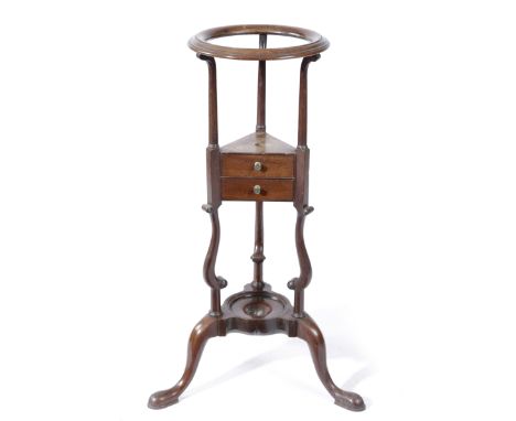 A GEORGE II MAHOGANY WIG OR BASIN STAND MID-18TH CENTURY the moulded circular top above scroll supports, with two drawers, on