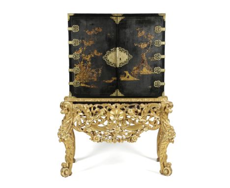 A BLACK JAPANNED CABINET ON A GILTWOOD STAND EARLY 18TH CENTURY AND LATER with gilt raised decoration depicting chinoiserie s