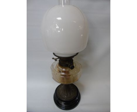 Antique metal and glass oil lamp with milk glass shade approx 22" tall