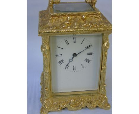 Gilded brass 4 glass ornate cased enamel faced carriage clock