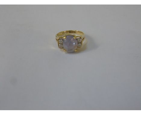 18ct Diamond and opalescent stone ring