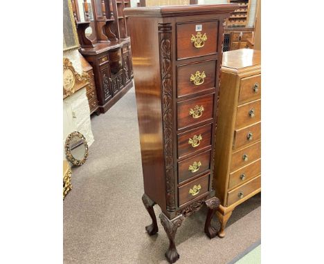 Polished and carved mahogany six drawer CD chest on ball and claw legs, 141.5cm by 40cm by 32cm.