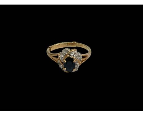 Sapphire and diamond fancy setting 9 carat gold ring, size R.