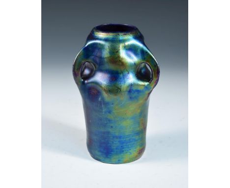 A Continental Art Nouveau Eosin glazed vase, possibly Zsolnay, the iridescent body with three pinched handles, unmarked 20cm 