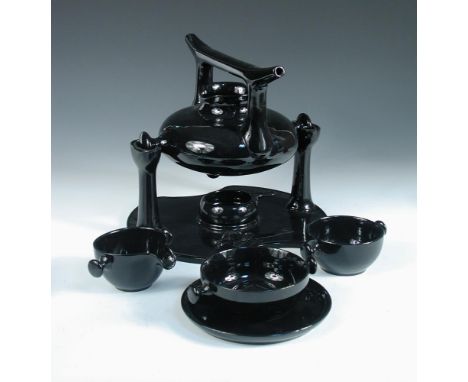 Luigi Colani for Friesland, Melitta, Germany, a black glazed 'Zen' tea service, designed 1973, comprising teapot, stand and b