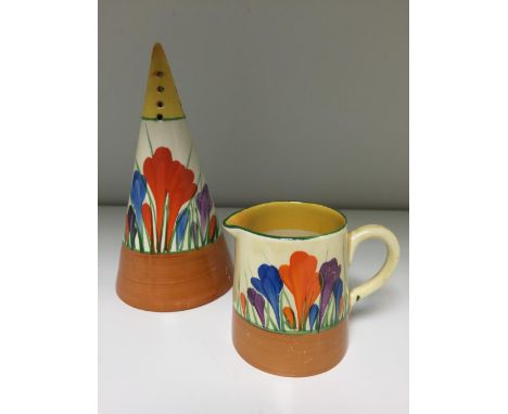 A Clarice Cliff Crocus pattern conical sifter, painted in colours with printed marks, together with a similarly decorated cre