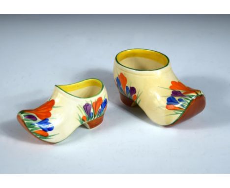 Two Clarice Cliff crocus pattern clogs, each painted in colours, printed marks, the larger 13cm long 