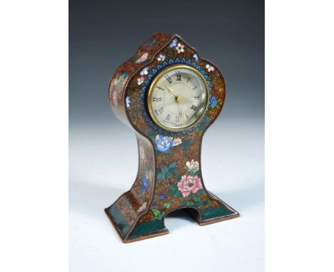 A cloisonné enamel cased mantle clock, decorated with flowers to an aventurine ground, the silvered dial with Roman numerals,