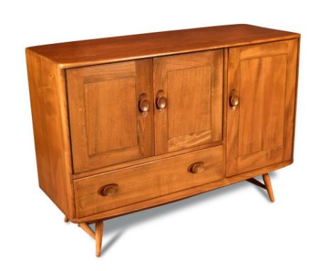 An Ercol elm sideboard, the rounded rectangular top above single right-hand cupboard with integral cutlery drawer within, a p