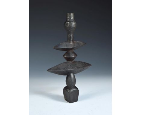 A cast iron candlestick, cast after a design by Diego Giacometti, signed to base 33½cm (13in) Diego Giacometti (1902-1985) wa