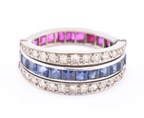 An Art Deco sapphire, ruby and diamond flip ring. The Art Deco 'day and night ring' ring having a central eternity band half 