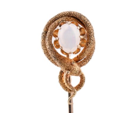 A Victorian gold and opal snake stick pin. The Victorian yellow gold stick pin having a claw set opal cabochon enveloped by a