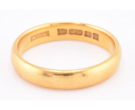 A hallmarked 22ct gold band ring. The polished 22ct yellow gold band ring hallmarked for London, 1964. Width 4mm. Size S.5-T.