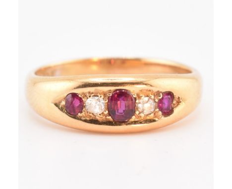 An Edwardian hallmarked 18ct gold, ruby? and diamond? boat ring. The 18ct yellow gold ring set with three graduating oval cut