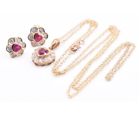 9ct gold ruby and diamond pendant necklace and earring set. Stamped 375. Weight 2.20g. All weights, measurements and sizes ar