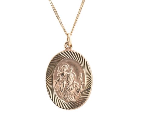 A hallmarked 9ct gold St Christopher pendant necklace. The hallmarked 9ct yellow gold St Christopher pendant strung on a curb