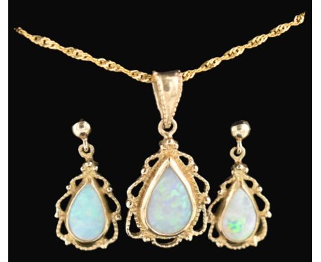 A hallmarked 9ct gold and opal pendant necklace and a pair of 9ct gold and opal pendant earrings. The lot to include a hallma