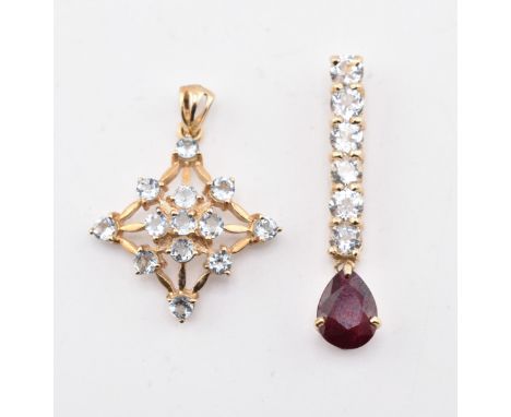 Two hallmarked 9ct gold, aquamarine and gem set necklace pendants. The lot to include a hallmarked 9ct gold, ruby and aquamar