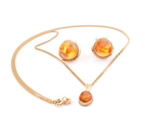 A hallmarked 9ct gold and amber pendant necklace and a pair of stud earrings. The lot to include a hallmarked 9ct gold and am