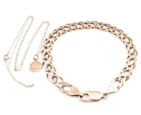 A 9ct gold fancy link chain bracelet and a 9ct gold St Christopher pendant necklace. The lot to include a 9ct gold fancy link