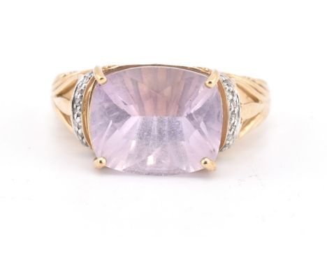 A hallmarked 9ct gold amethyst and diamond ring. The 9ct yellow gold ring set with a four claw set fancy cut rose de france a