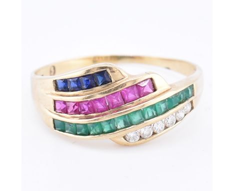 A 9ct gold diamond, ruby, emerald and sapphire ring. The 9ct yellow gold ring set with a row of six channel set round brillia