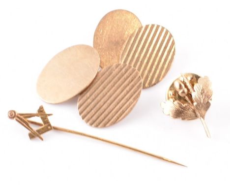 Collection of 9ct gold to include a pair of hallmarked 9ct cufflinks, Masonic pin, and button stud. Total weight 9.23g. All w