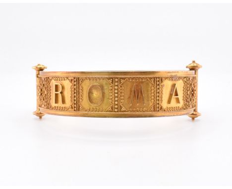 A Victorian gold Roma Etruscan style bangle cased. The Victorian gold Archaeological Revival hinged bangle having Etruscan st