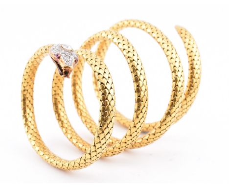 A 19th century French 18ct gold diamond and ruby serpent bangle. The antique French 18ct yellow gold bracelet modelled as an 