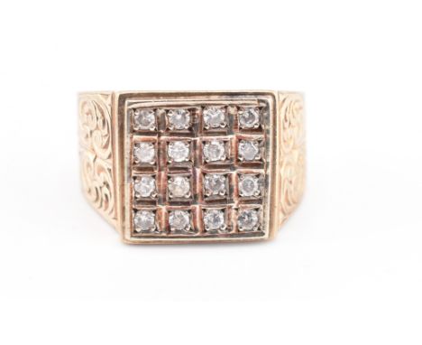 A hallmarked 9ct gold and diamond signet ring. The 9ct yellow gold ring having 16 round brilliant cut diamonds set in a squar
