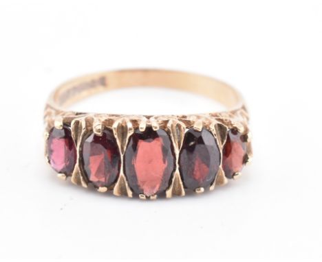 A hallmarked 9ct gold and garnet ring and a hallmarked 9ct gold signet ring. The lot to include a hallmarked 9ct gold and gar