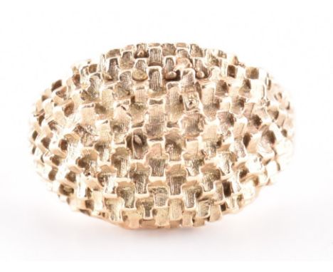 Hallmarked 9ct gold dome ring. The ring having a texture dome to a tapering shank. 6.3g. Size N. All weights, measurements an