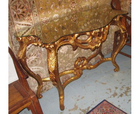 CONSOLE TABLE, Louis XV style gilt effect with a serpentine mirror top and flowerhead and scroll decoration on cabriole suppo