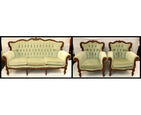 MODERN THREE PIECE SUITE
comprising a shaped three seat sofa with a button back and scroll arms, and two similar armchairs, a