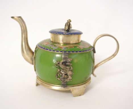 SMALL CHINESE TEAPOT
the jade coloured glass body with decorative white metal mounts and dragons to both sides, the shoulders