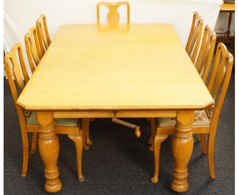 VICTORIAN LIGHT OAK EXTENDING DINING TABLE
with canted corners and an extra leaf, standing on turned supports with later cast