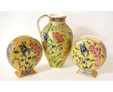 PAIR OF PERSIAN STYLE ZSOLNAY - FISCHER J BUDAPEST CIRCULAR VASES AND MATCHING JUG
with ornate polychrome floral decoration o