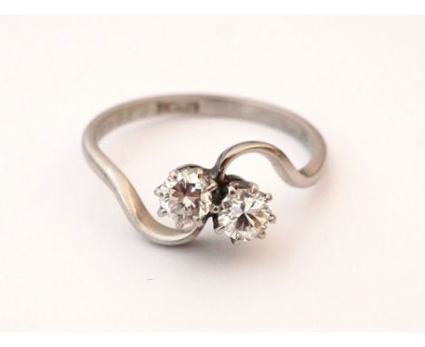 DIAMOND TWIST SET TWO STONE RING
on platinum shank, the diamonds totalling approximately 0.5cts, ring size J-K