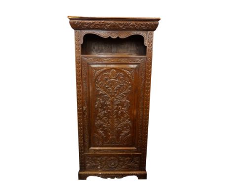 CARVED OAK HALL CUPBOARD
the moulded carved cornice above an open hat shelf with a large cupboard door below, carved with an 