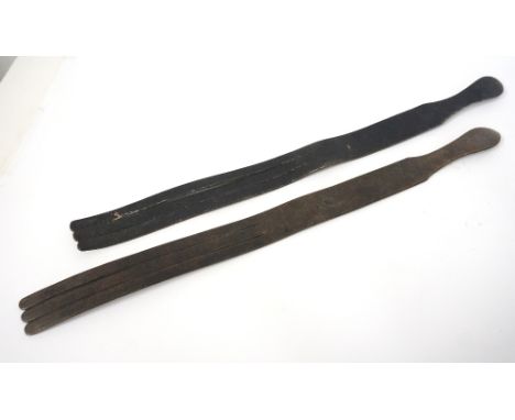 TWO VINTAGE LEATHER TAWSE
both marked 'J.G. Stevenson, Glasgow' and one stamped 355, both with three tongues, 62cm long 
