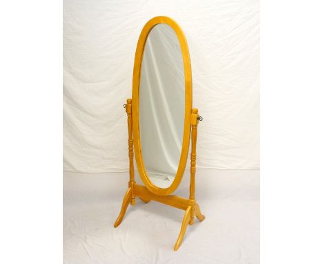 LIGHT OAK OVAL CHEVAL MIRROR
on shaped supports with splayed feet, 155cm high