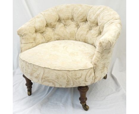 VICTORIAN BUTTON BACK NURSING CHAIR
with a stuffover seat standing on stout tapering supports with brass castors 